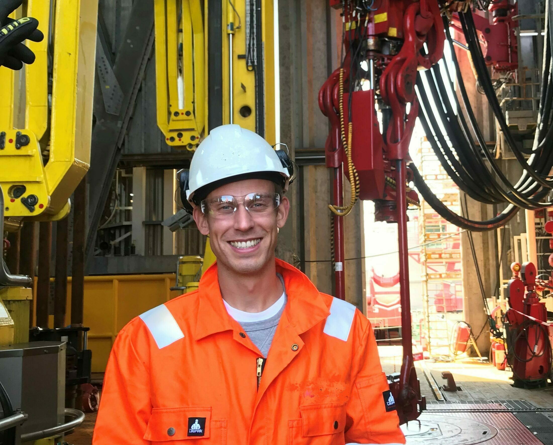 Smiling man on oil rig